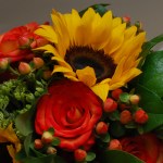 Closeup of wedding bouquet of sunflowers and roses