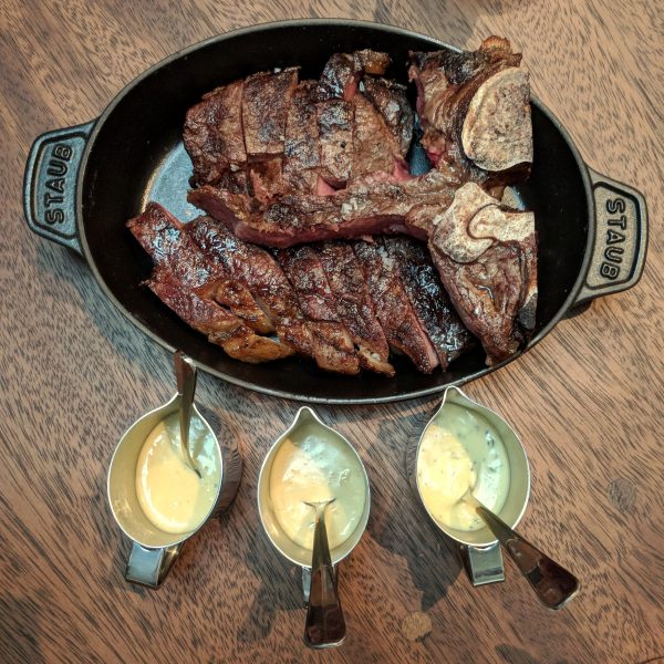 Porterhouse and a selection of sauces. Perfectly cooked.