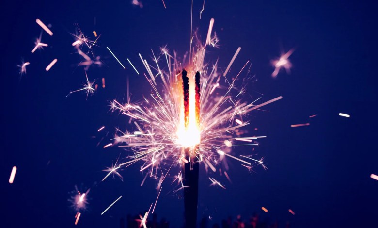 time-lapse photography of sparkler at night time