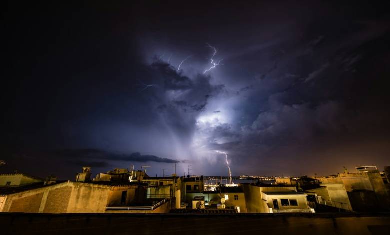 white concrete building under lightning at nighttime