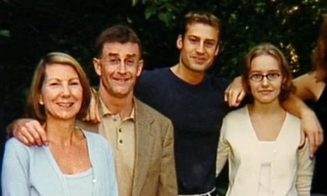 Michael Peterson and his family standing together outdoors before the events depicted in The Staircase documentary.