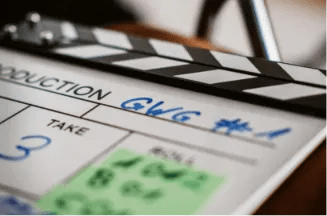 Close-up of a film production clapperboard used for organizing a film shooting schedule on a movie set.