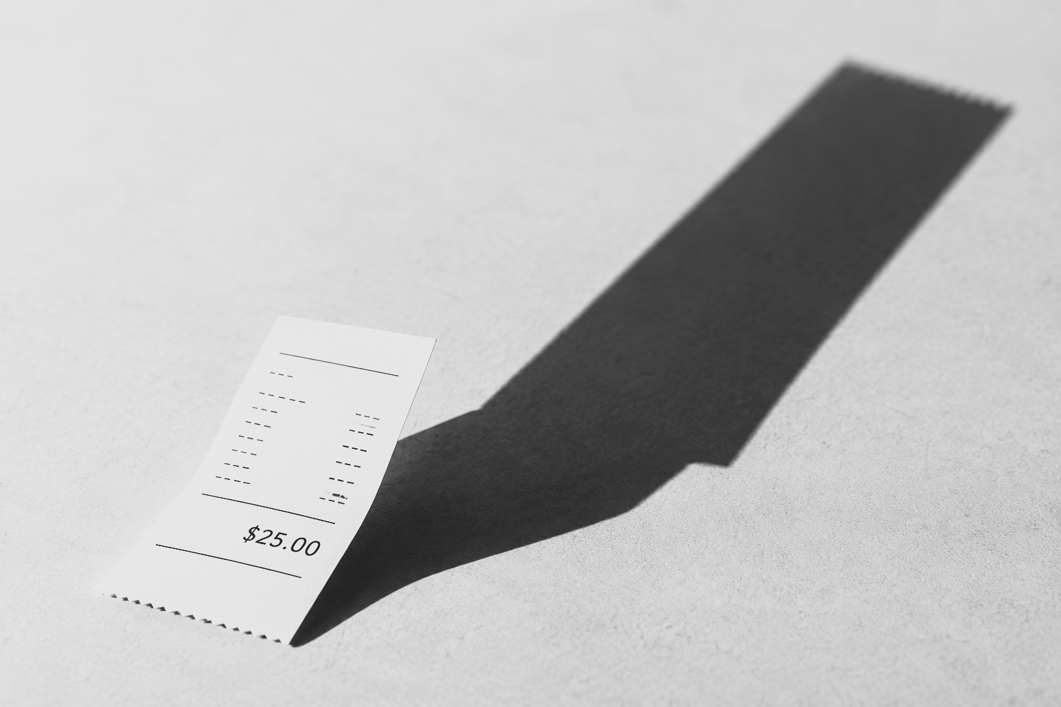 $25 receipt casting a long shadow, illustrating the long-term cost of everyday spending.