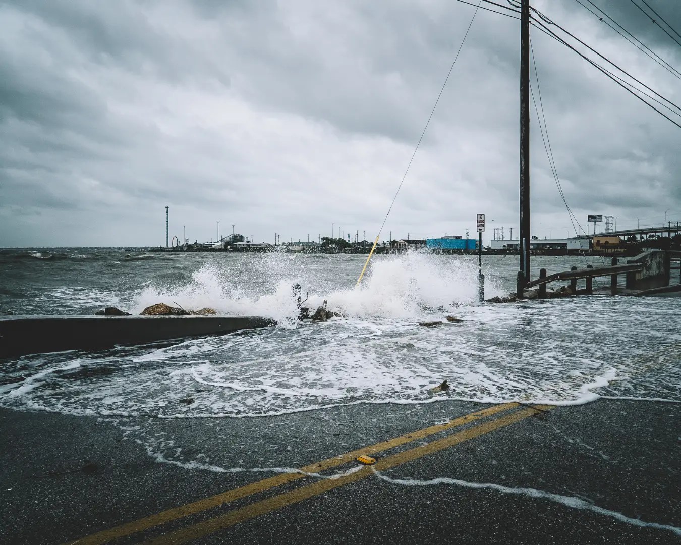 Water crashing over bridge during Hurricane.