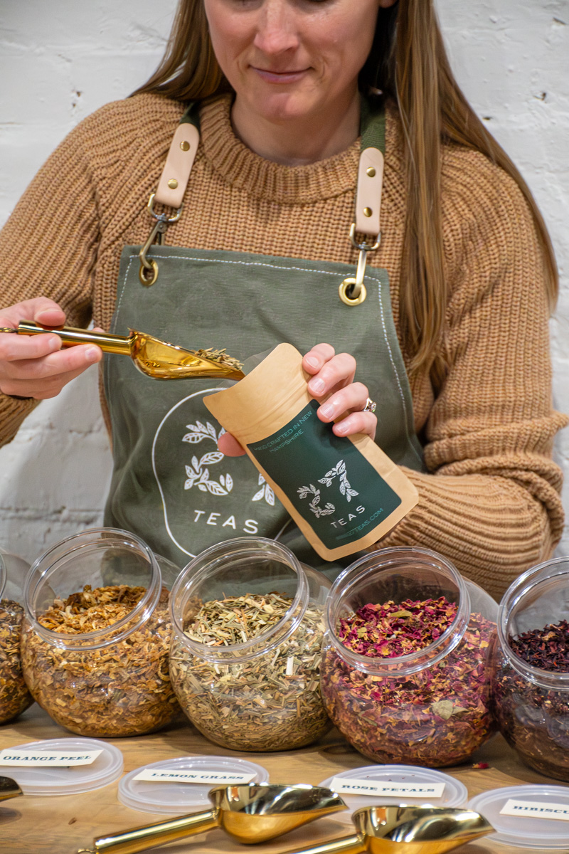 Adding tea to bag for a blend your own tea bar