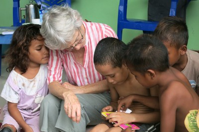 Mentoring takes many forms...Pip shows some local kids picture books from New Zealand.