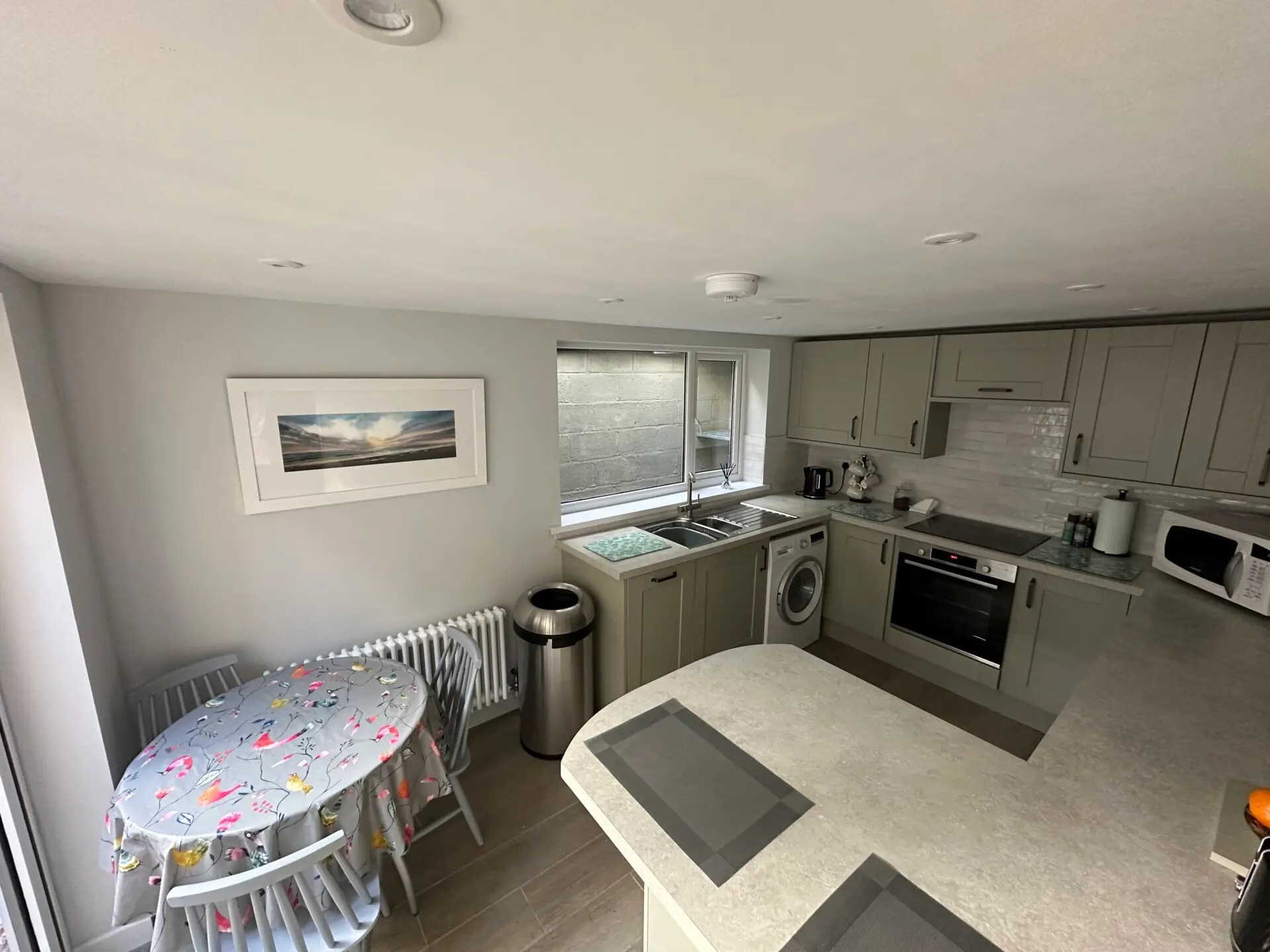 Kitchen with table and all modern amenities