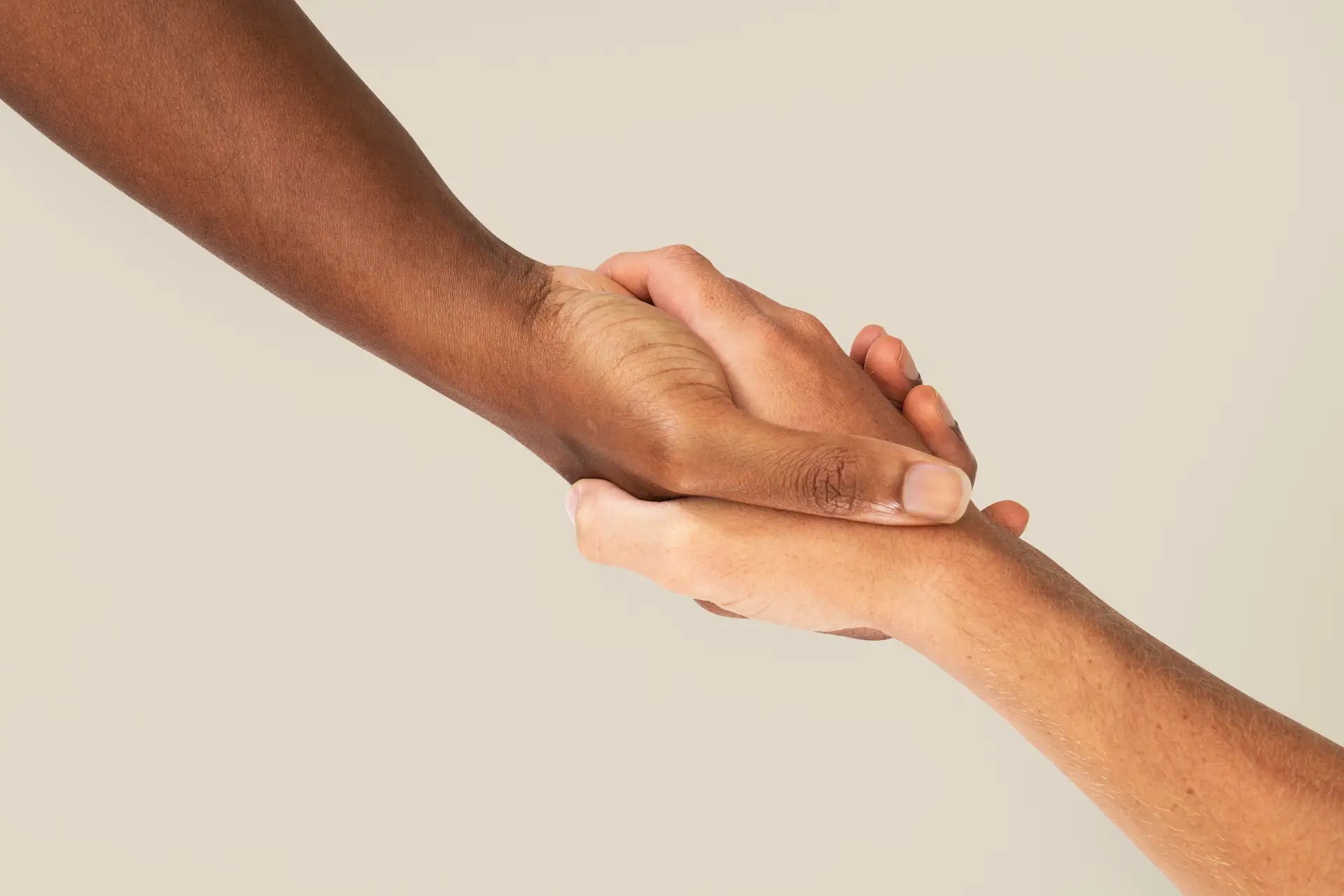 Two hands holding each other