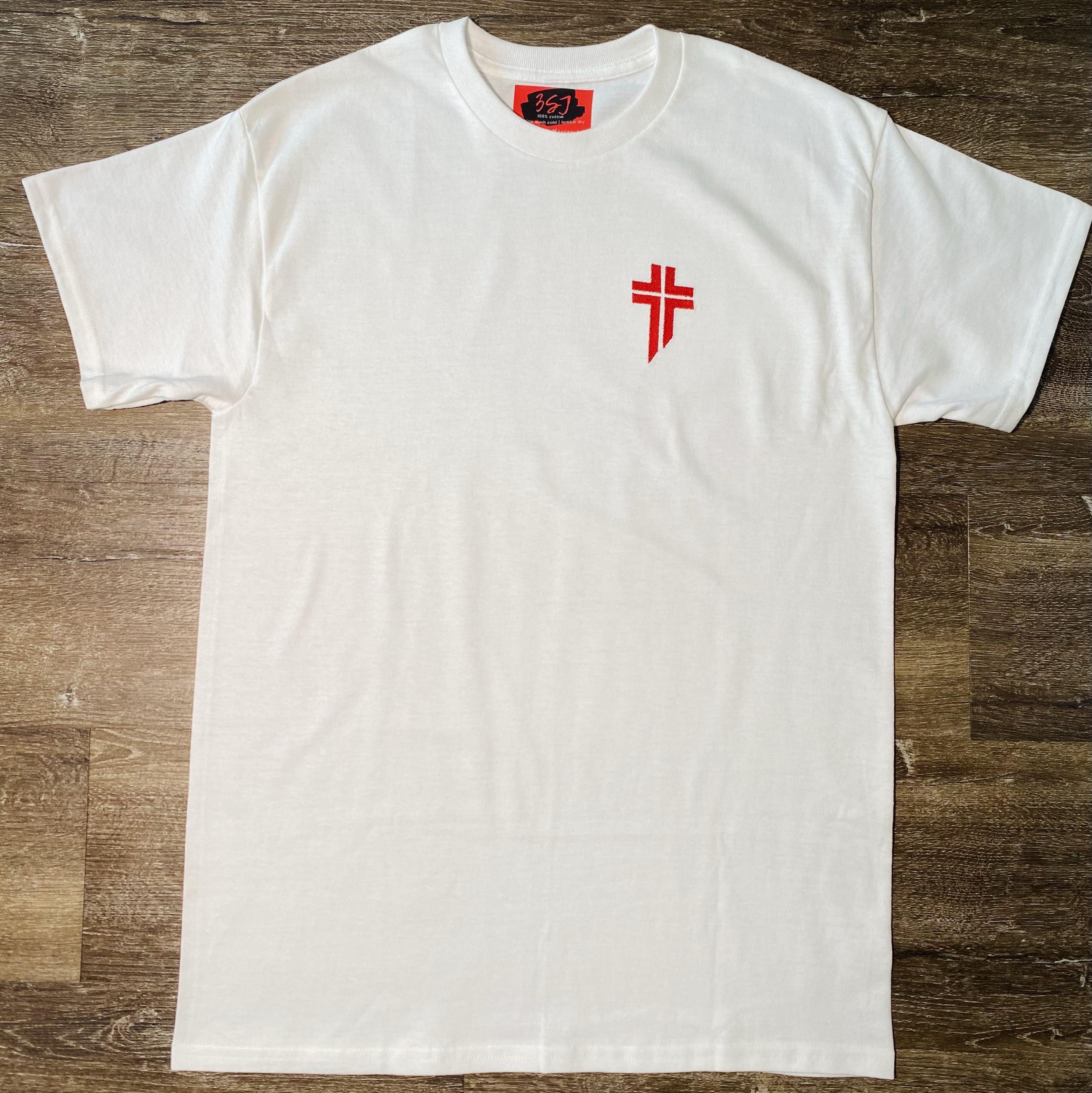 White embroidered T-shirt featuring the red Lebanese Forces Cross on the left chest, shown laid flat.