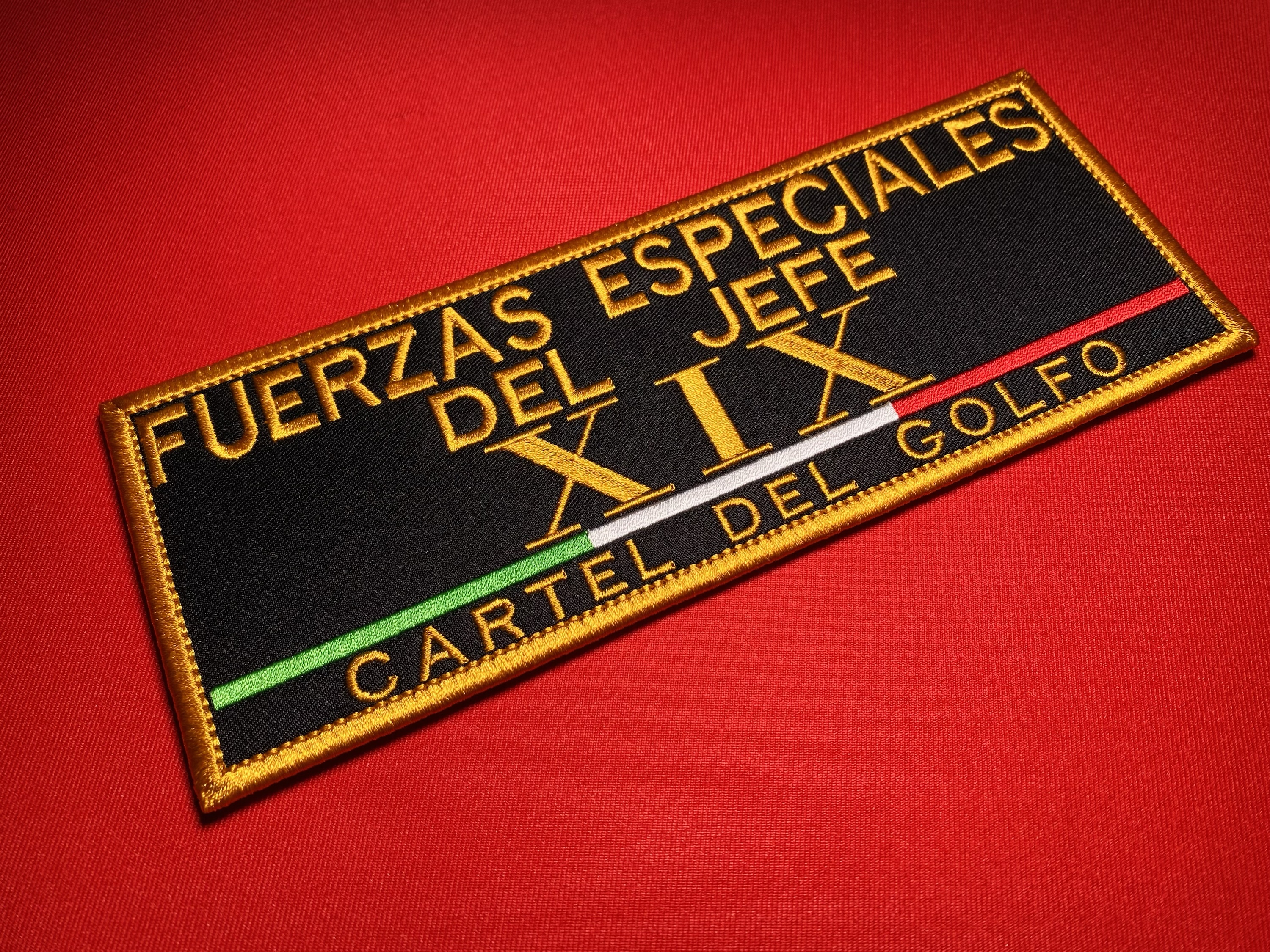 Large black and gold embroidered reproduction patch reading “Fuerzas Especiales del Jefe XIX” and “Cartel del Golfo,” featuring the Roman numeral XIX and a green, white and red tricolor stripe.