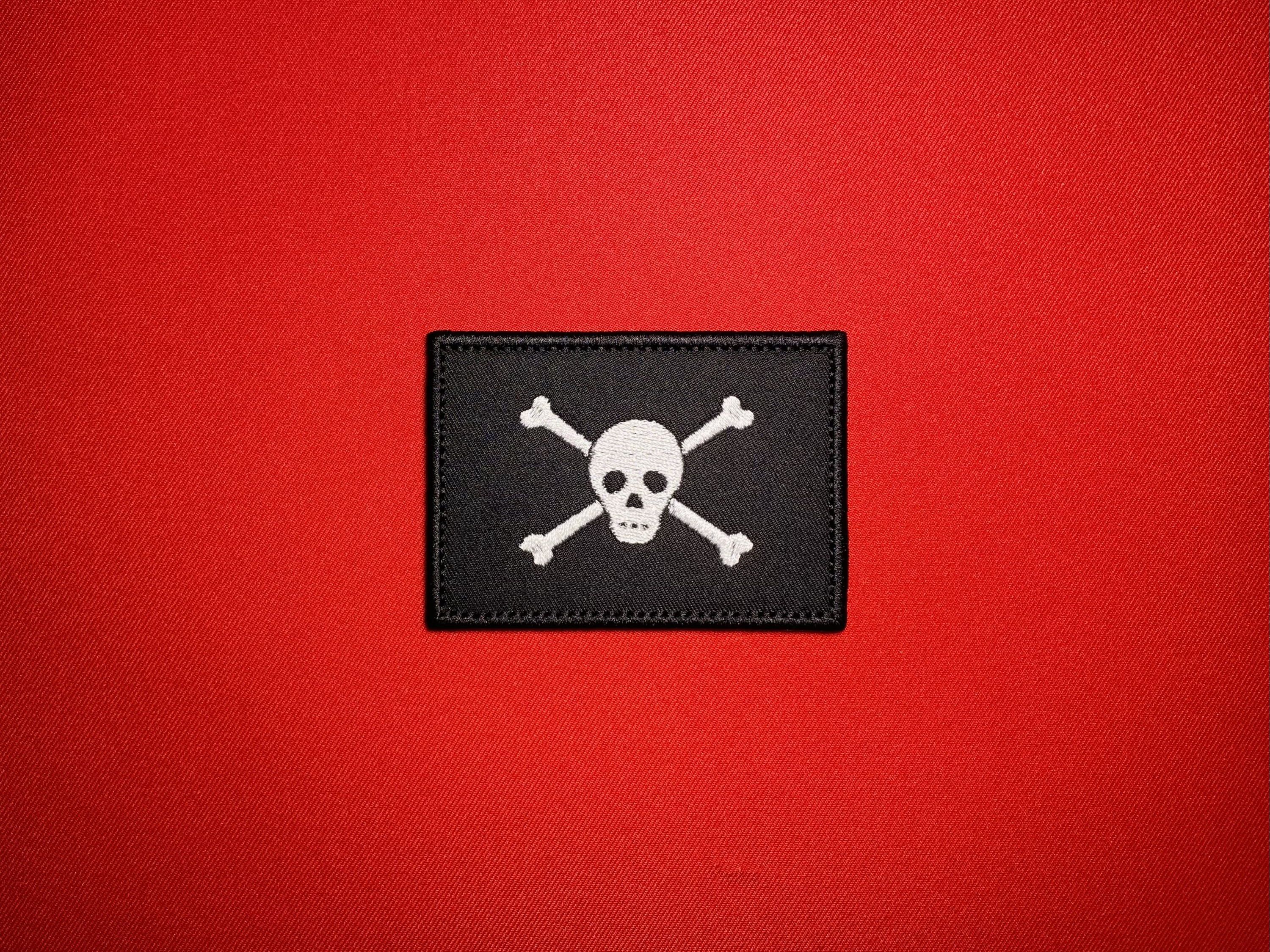Biafran 4th Commando Brigade embroidered reproduction patch featuring a white skull and crossbones on a black field.