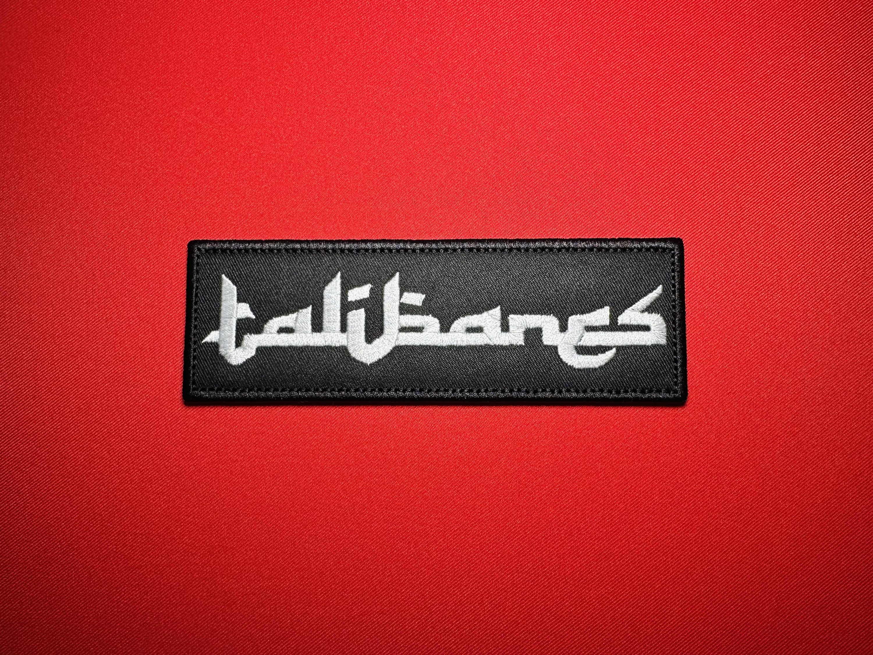 Front view of the 2×6-inch Los Talibanes replica embroidered patch, attributed to La Línea/Nuevo Cártel de Juárez (NCDJ), featuring white lettering and a black satin border.