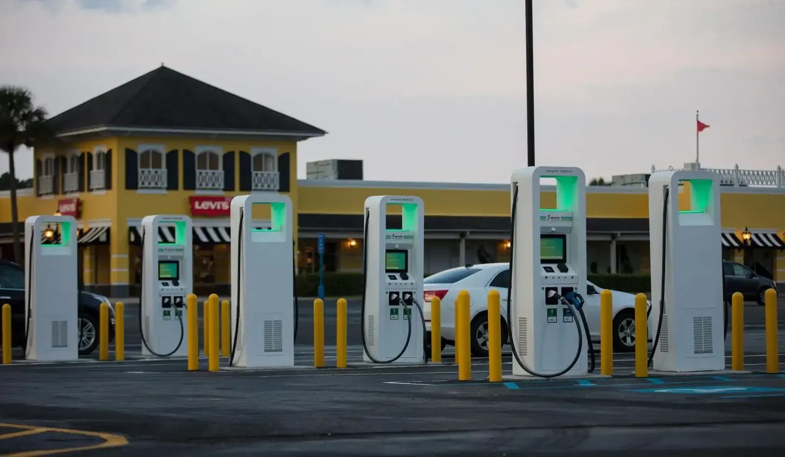Row of EV charging stations at a shopping center parking lot