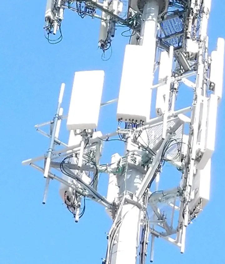 Close view of an antenna array and radios on a tower