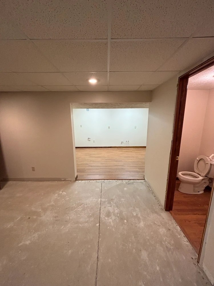 Flood damaged basement, gutted to the studs before restoration work begins