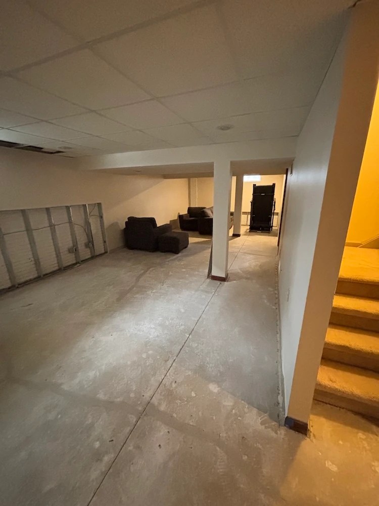 Flood damaged basement, gutted to the studs before restoration work begins