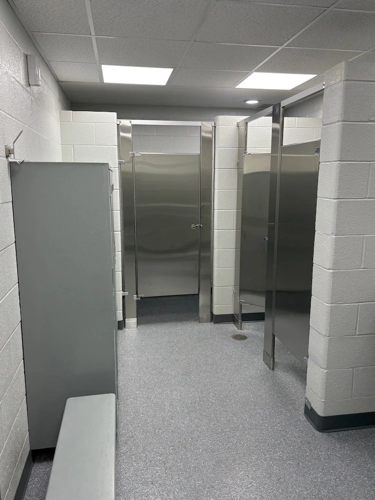 Sifco employee locker room, post-renovation: fresh paint, stainless steel dividers