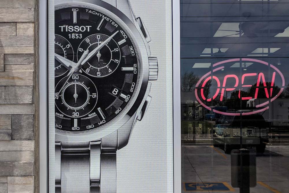 window signage window vinyl window cling perforated window vinyl invisa-view display windows graphics print printing printer graphics design visual merchandising installation visuals Outdoor See-through Perforated vinyl Window Vinyl Mesh adhesive vinyl