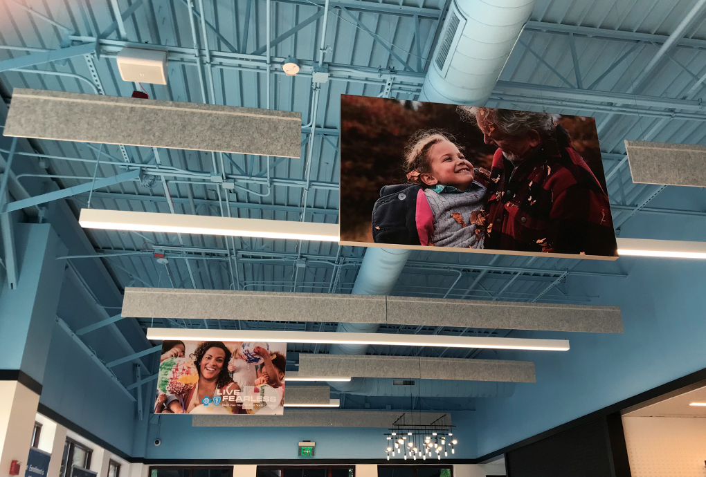 healthcare banners hanging from industrial ceiling