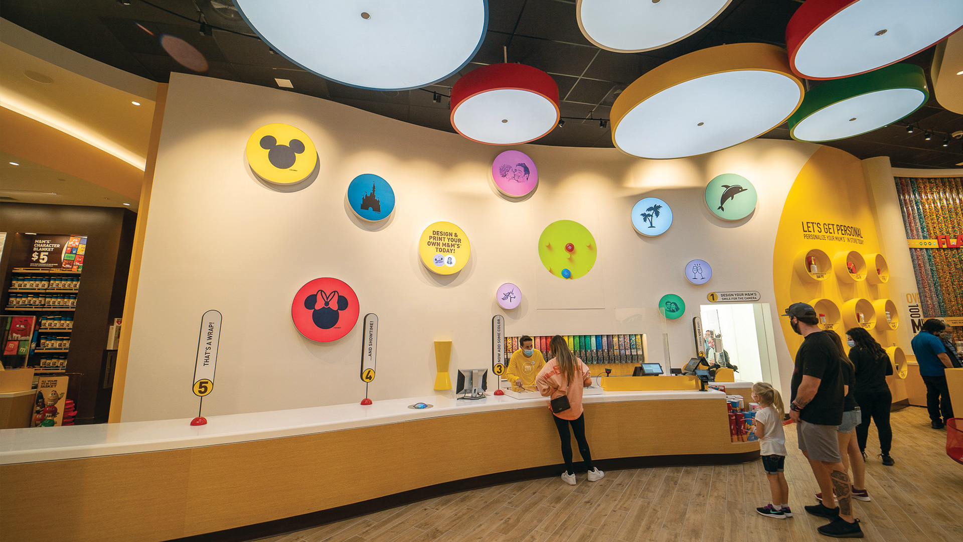 Disney Store Wall behind cash wrap dotted with circle graphics