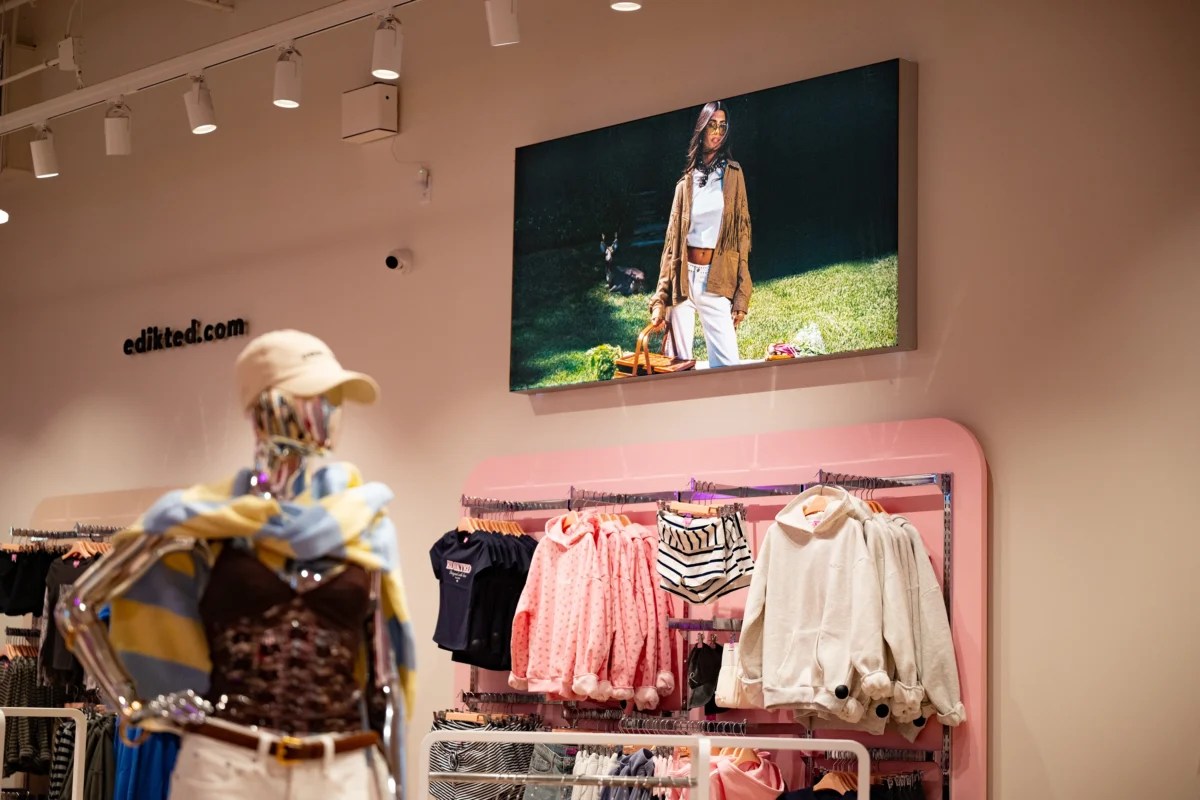 Backlit signage for retail stores featuring illuminated display graphics and bold visual branding