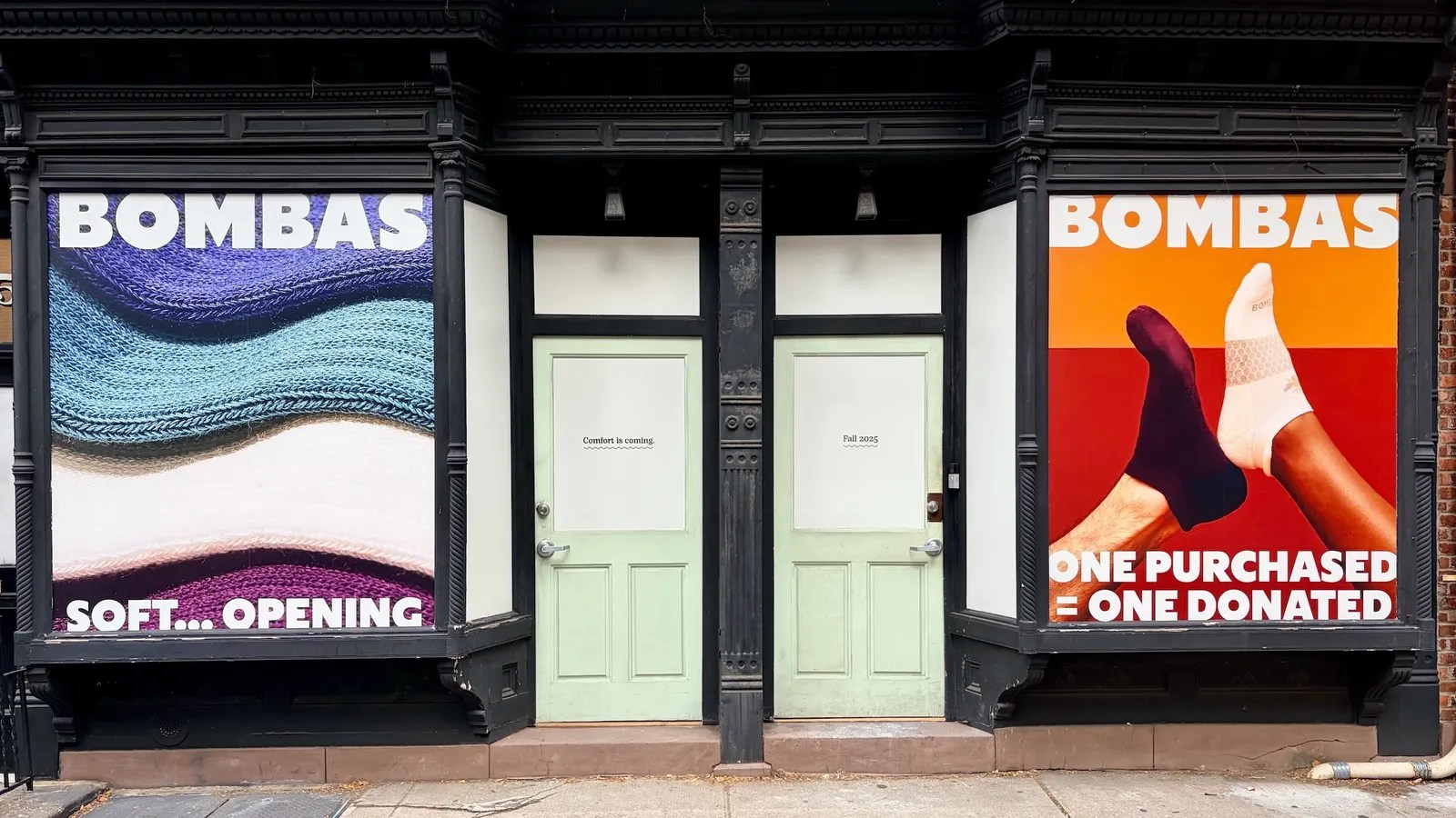 Bombas retail store exterior announcing new physical store openings with branded logo signage and storefront graphics