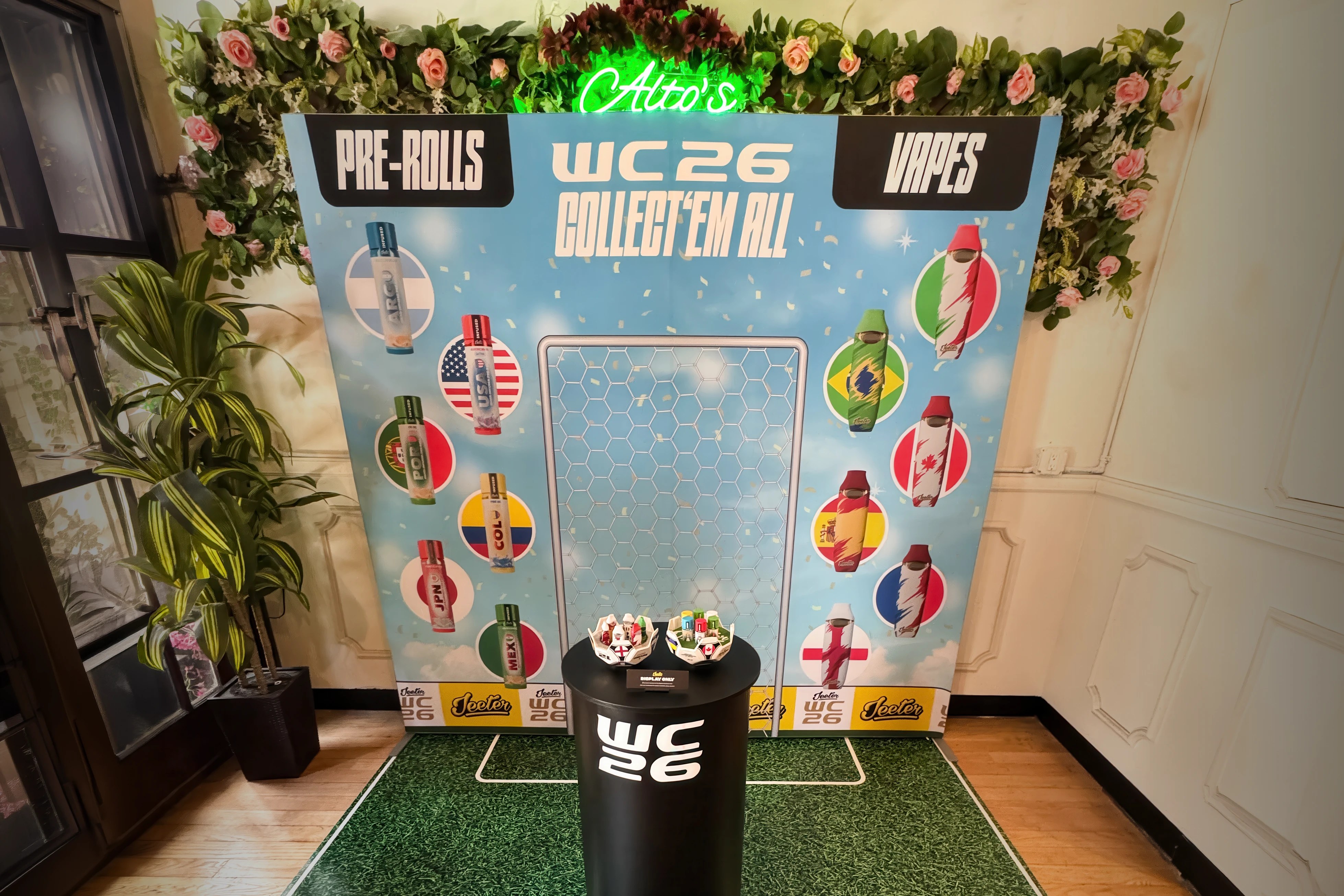 Jeeter WC26 in-store brand activation with large-format printed display wall, vinyl-wrapped pedestal, floor graphic, and category wayfinding signage headers