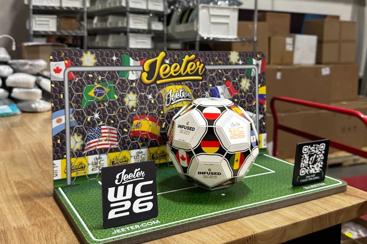 Jeeter WC26 tabletop retail display using signage substrates including printed sintra base, branded backdrop panel, QR code sign, and astroturf floor graphic