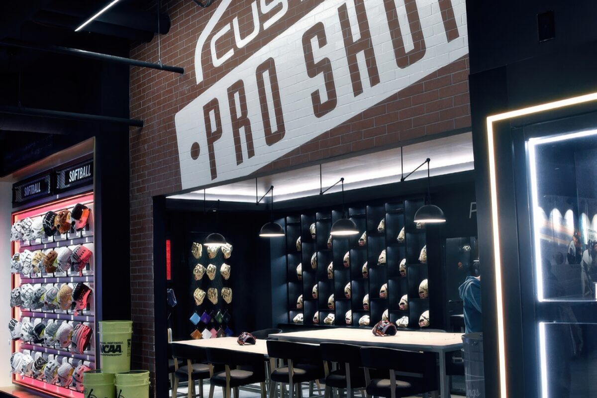 Pro Shop area in Rawlings Experience retail store featuring vinyl brick wrap signage, branded graphics, and custom glove display walls