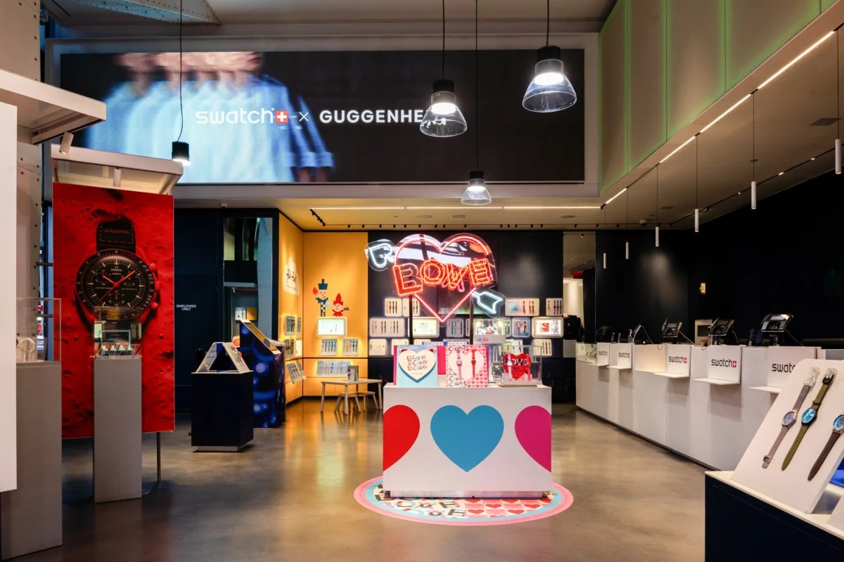 Swatch Times Square store interior with Guggenheim LED screen display showcasing branded signage and immersive visuals