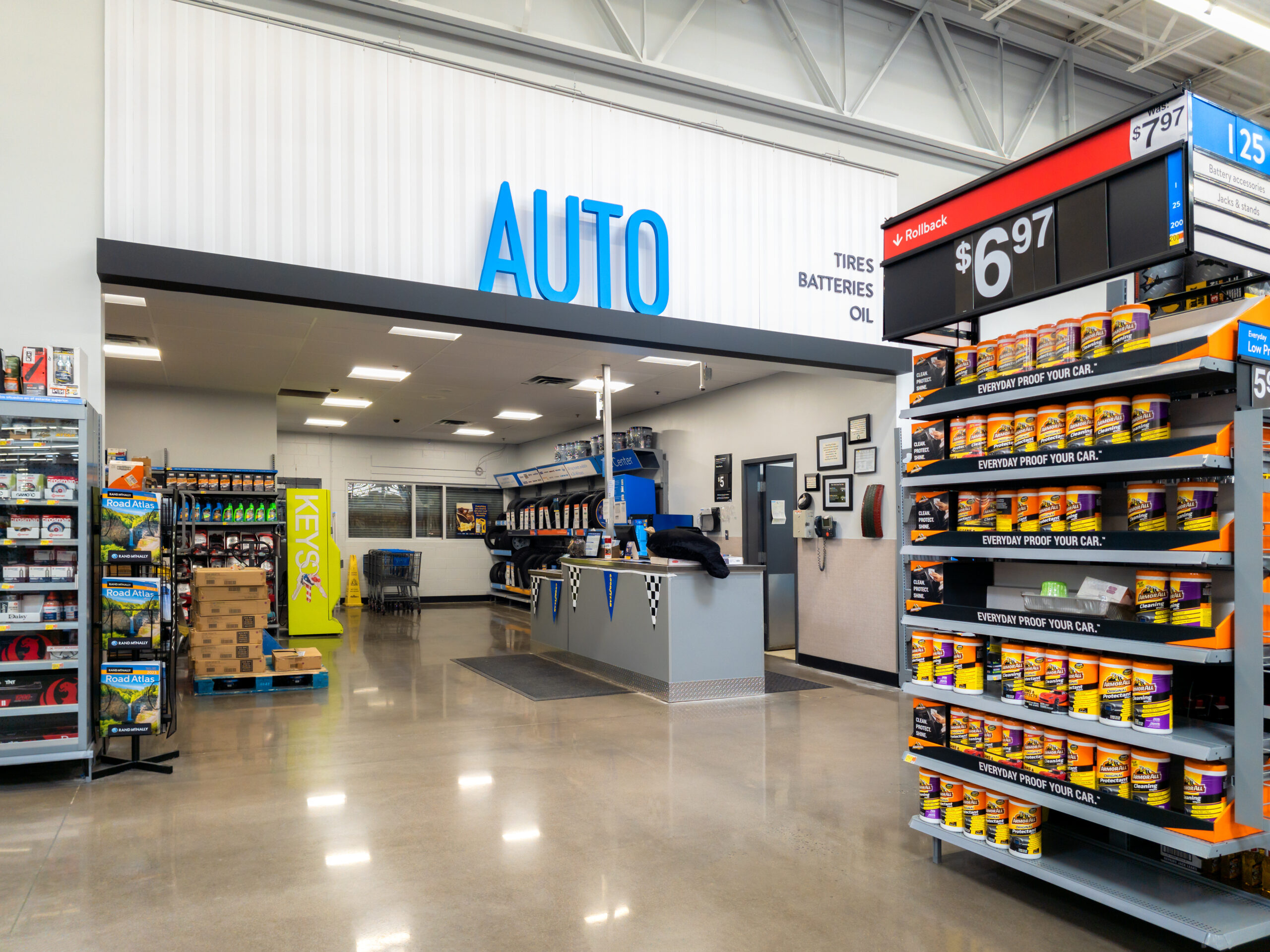 Walmart storefront promoting contactless car servicing with signage-style graphics on parking lot signage