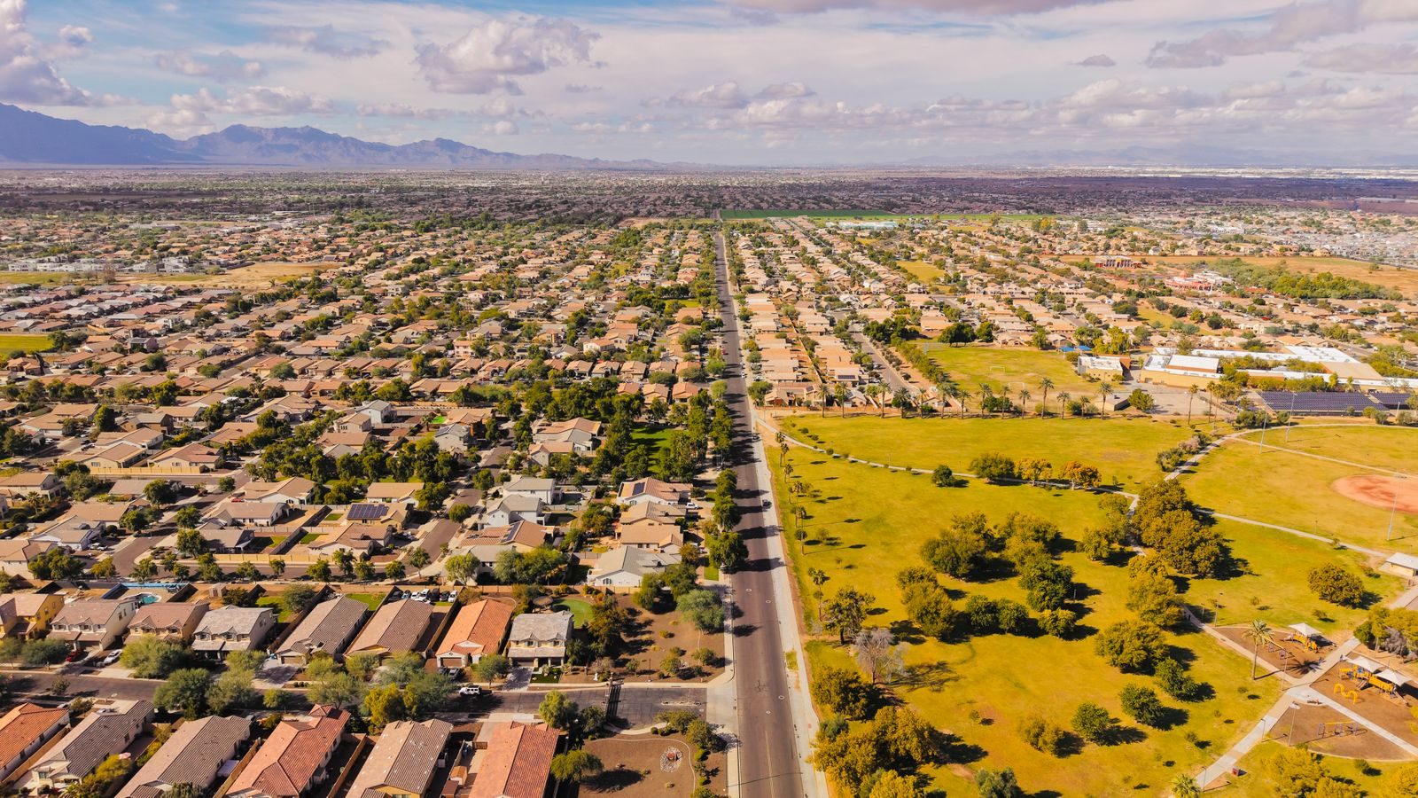 Stunning aerial view of a suburban neighborhood in Arizona with clear skies.