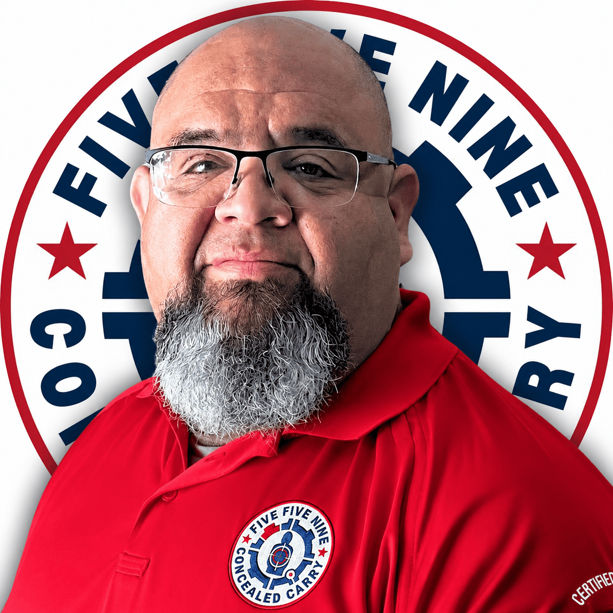 Paco Villarreal, 559CCW instructor, wearing a red 559CCW polo in front of the company logo.