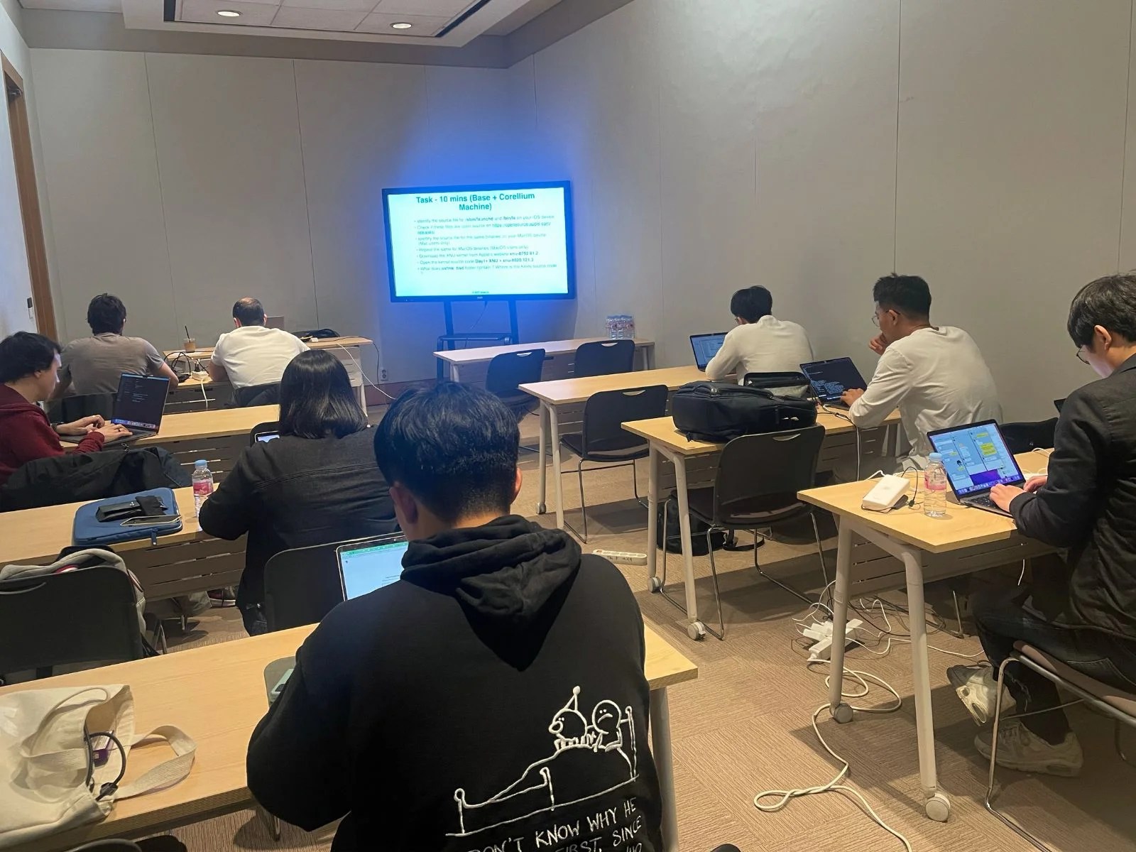 Close-up of participants at a mobile security training session.