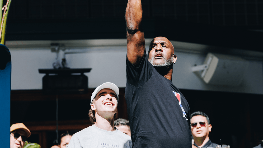 Gary Payton with his hand up during AW NBA activation | AW