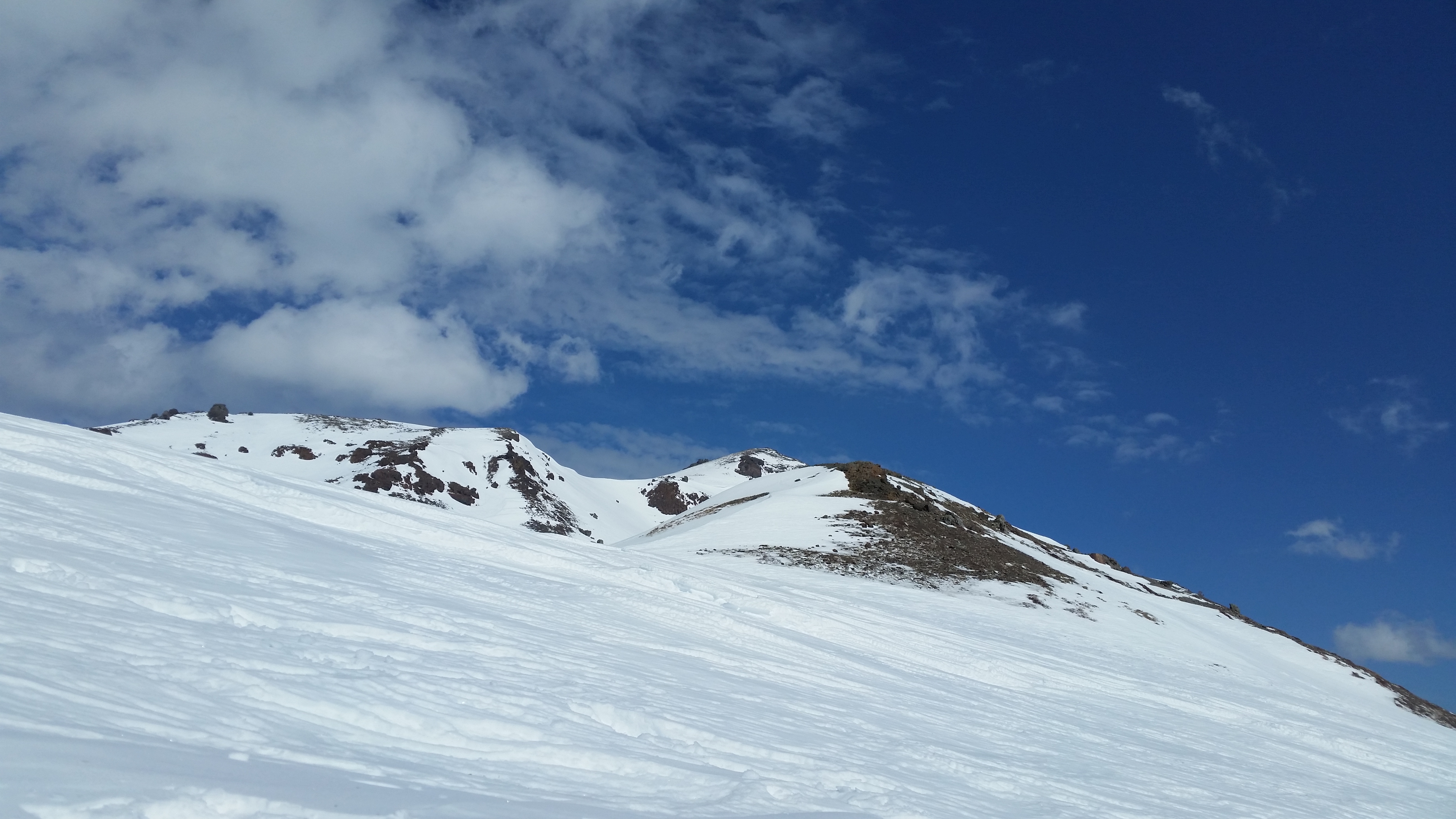 The summit looms. We made it to the rock on the left peak.