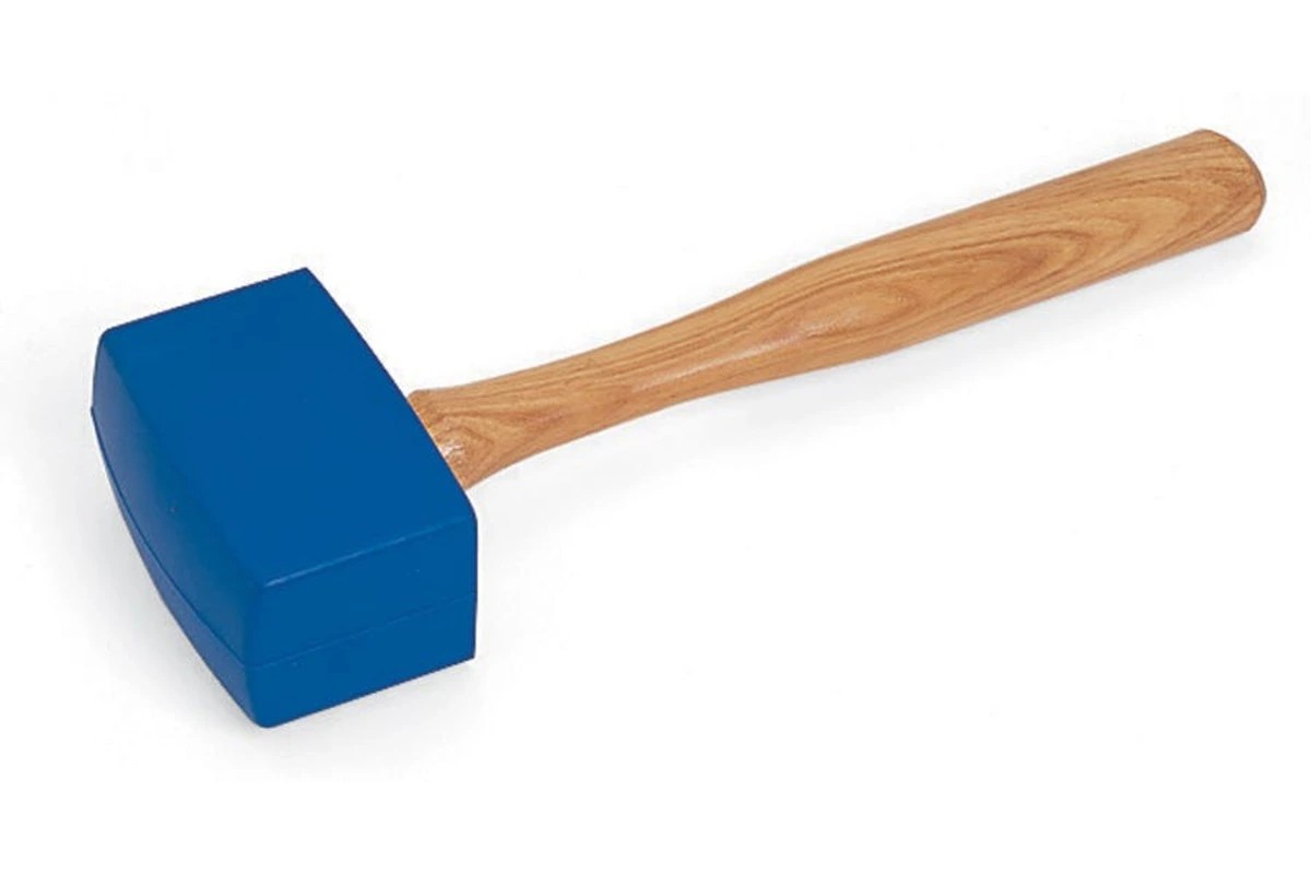 Rubber mallet with wooden handle and blue head on white background