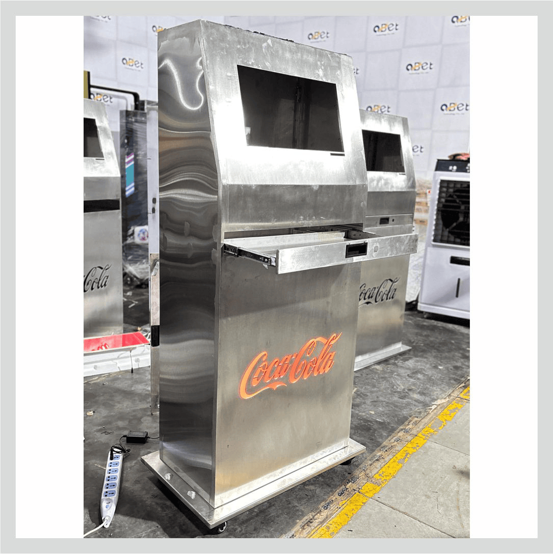 Steel welcome kiosk for Coca-Cola with an interactive touchscreen for visitor information and digital engagement