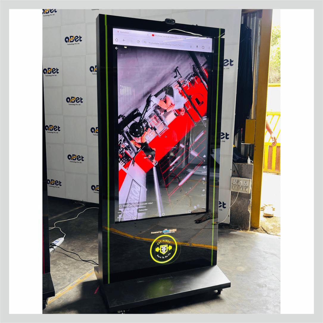 Digital signage kiosk for gym displaying fitness content, promotions, and member information