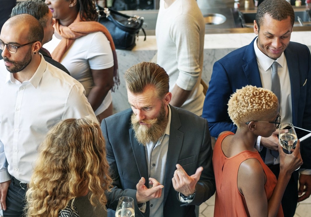 People are talking at a conference.