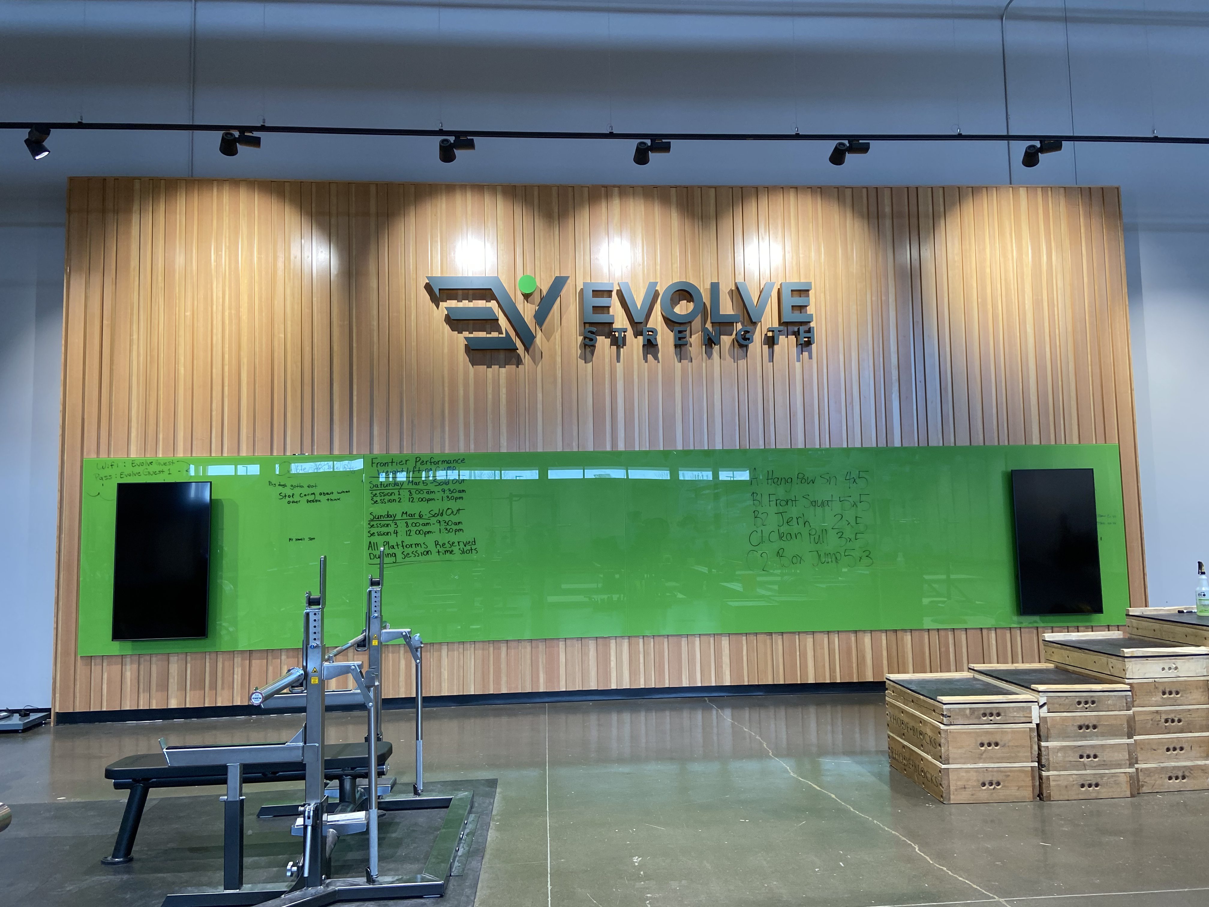 Custom reception desk at Evolve Strength Seton in Calgary