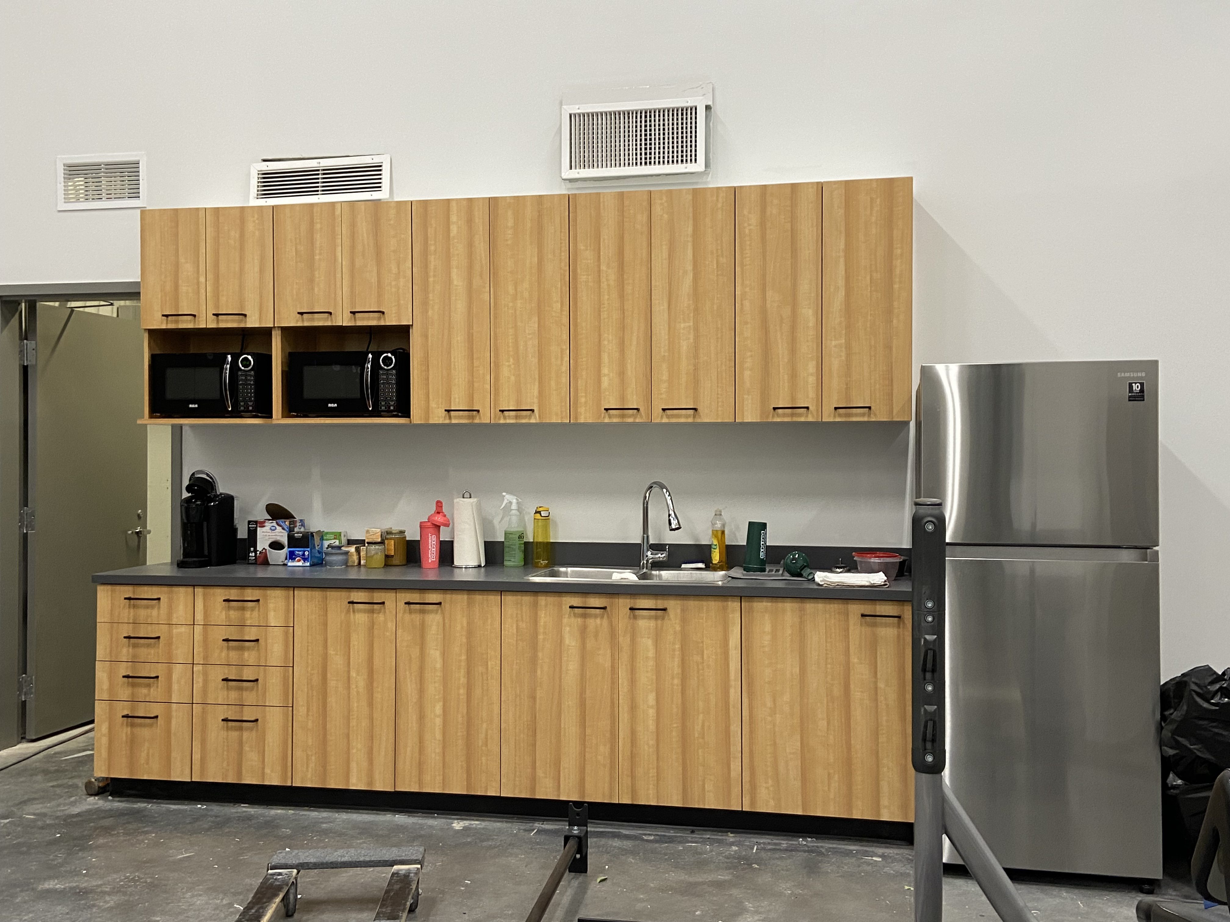 Wood feature wall and cabinetry at Evolve Strength Seton