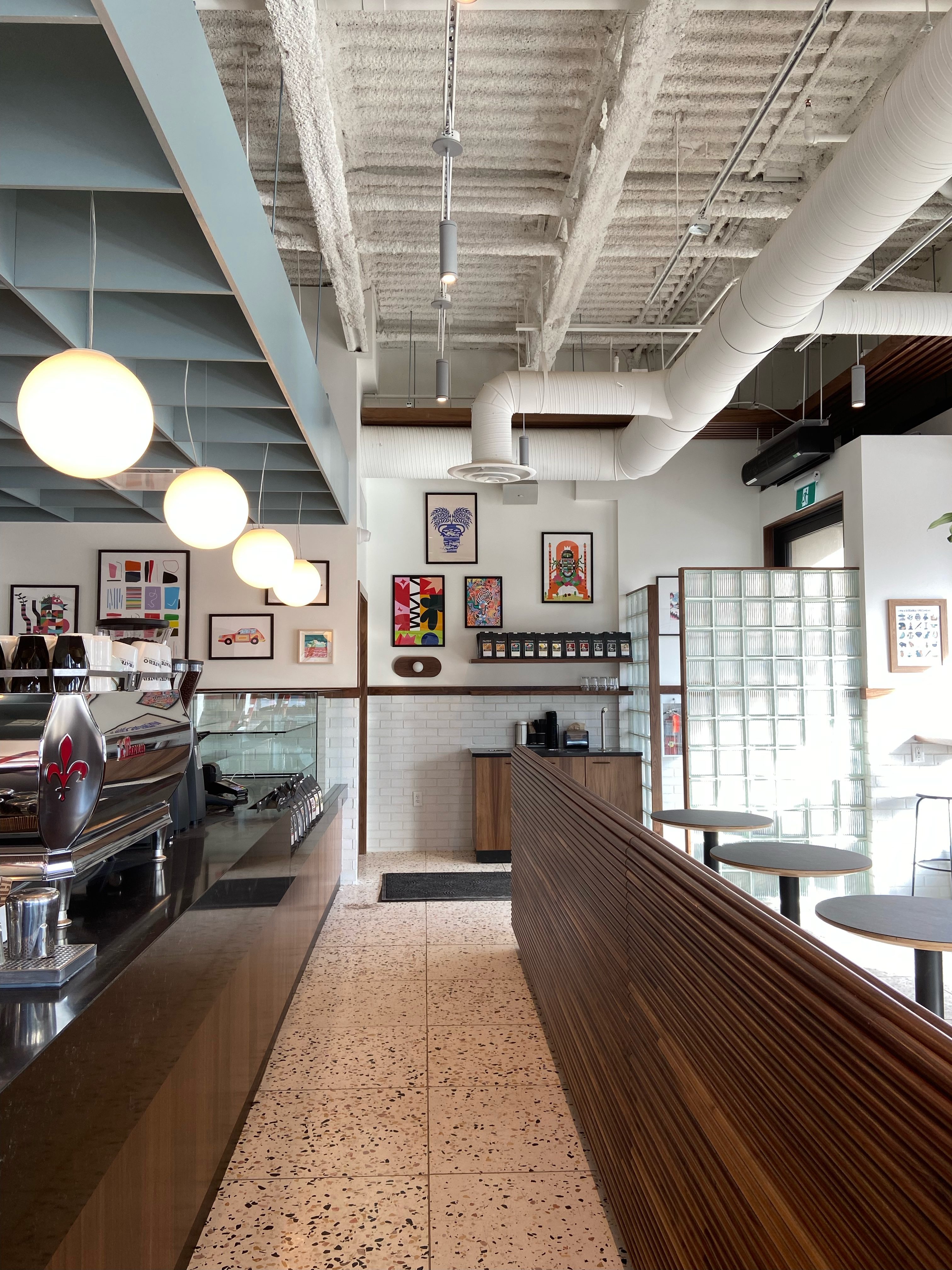 Custom café service counter and millwork at Pact Coffee Edmonton