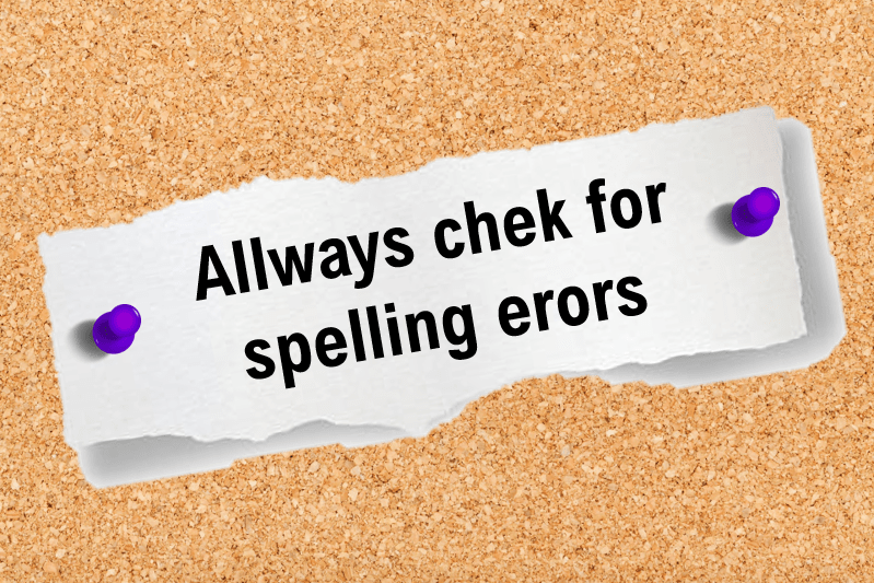 Paper with spelling errors pinned to a board, illustrating why proofreading is important for your brand.
