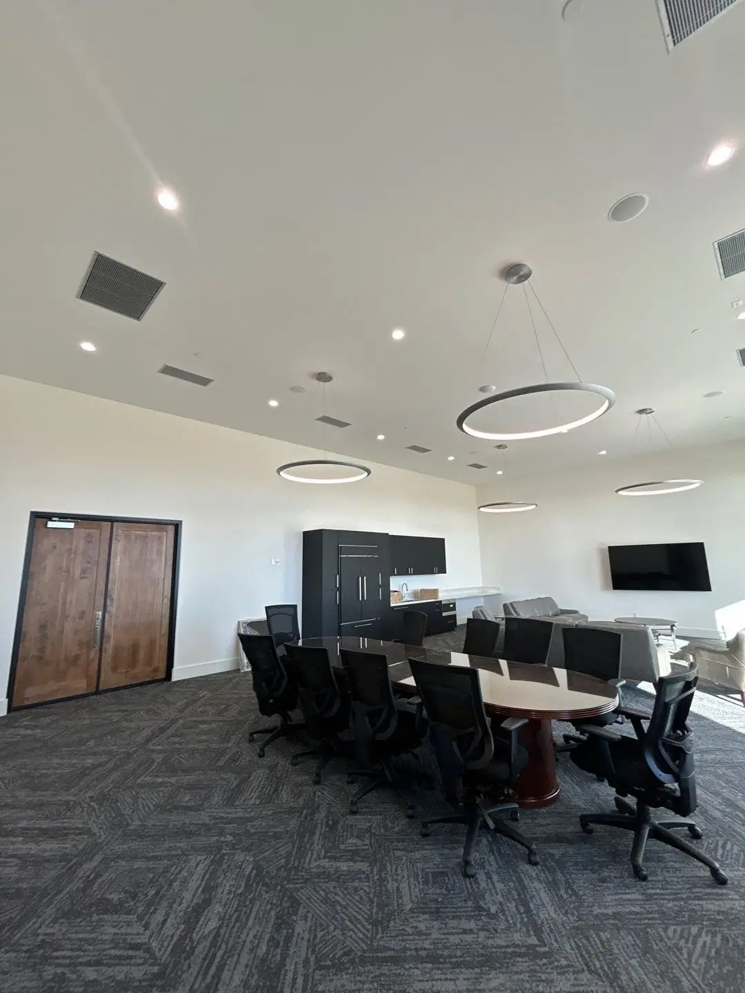 Interior photo of the conference room at Thermal Club in Thermal, CA, a racetrack, luxury experience business in Southern California. Services provided here include Air Balancing (TAB), Mechanical Acceptance Testing (MATT), and Lighting Controls Acceptance Testing (LCAT).