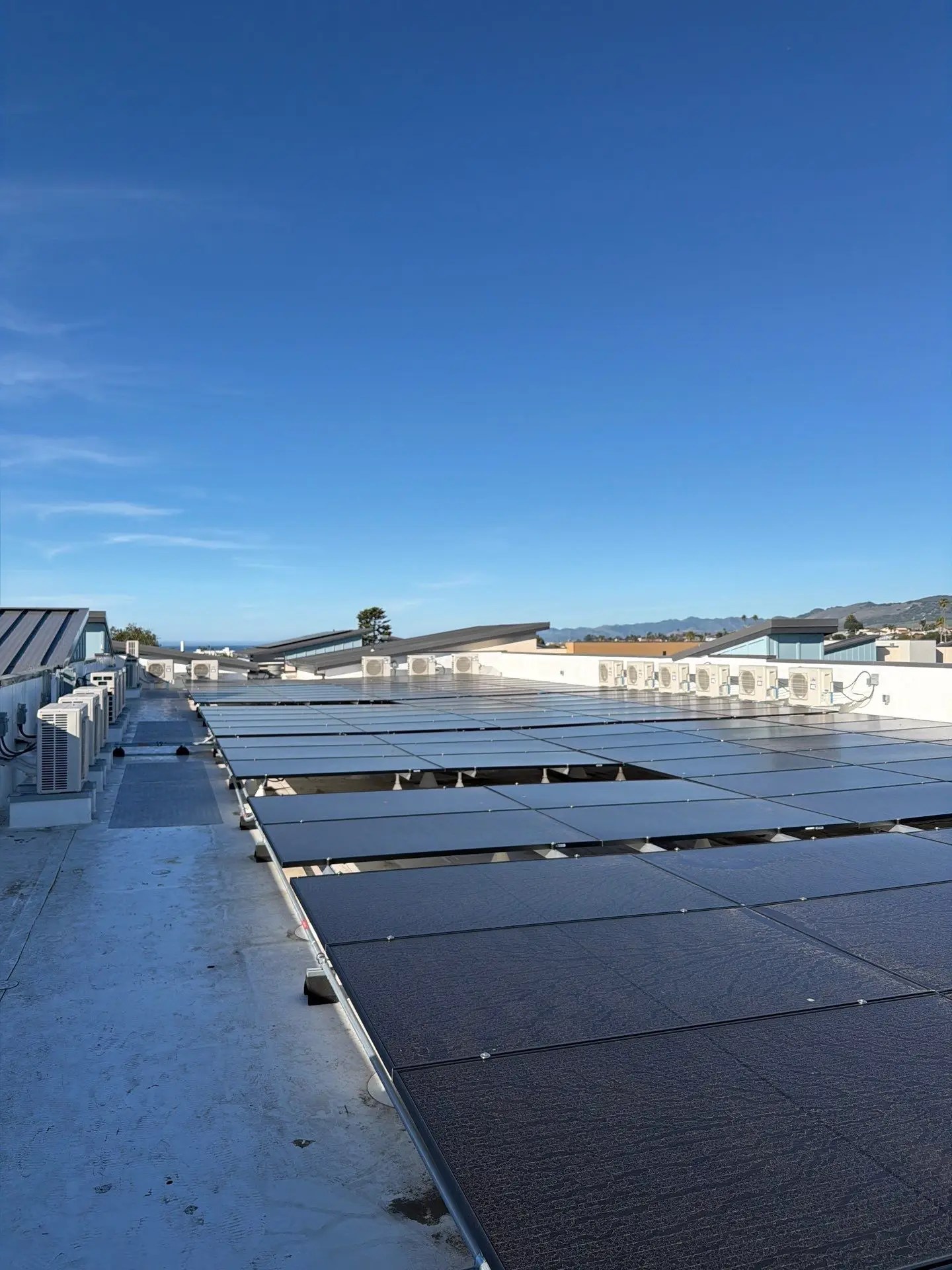 Rooftop photo of the Cleaver and Clark Commons, a multifamily complex in Grover Beach, San Luis Obispo County. Services provided here include ECC/HERS testing.