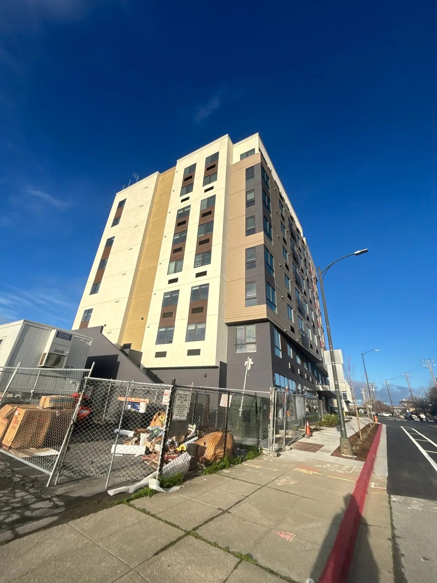 Exterior photo of the Eucalyptus Grove multifamily project in Burlingame, a city in San Mateo County. Bay Area and Northern California. Services provided here include ECC/HERS verifications and testing, mechanical acceptance testing (MATT), and lighting controls acceptance testing (LCATT).