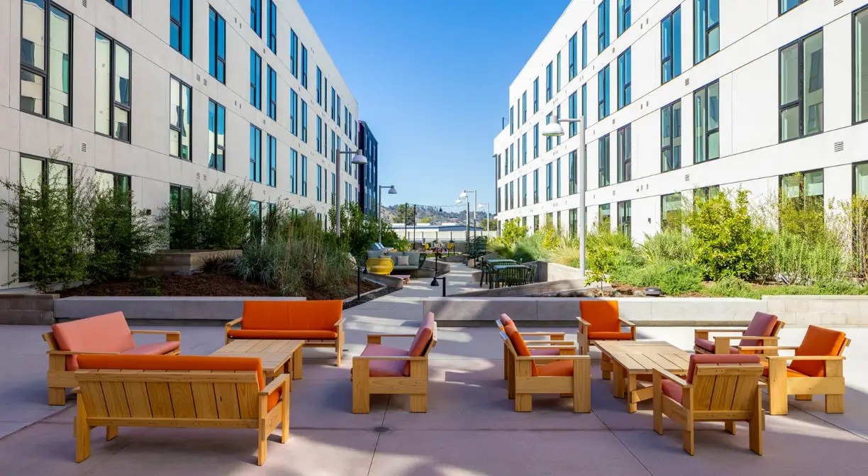 Photo of the outside common areas of the Avenue 34 Apartments, a multifamily complex in Lincoln Heights, Los Angeles, California. Services provided here include ECC verifications and tests and mechanical acceptance testing.