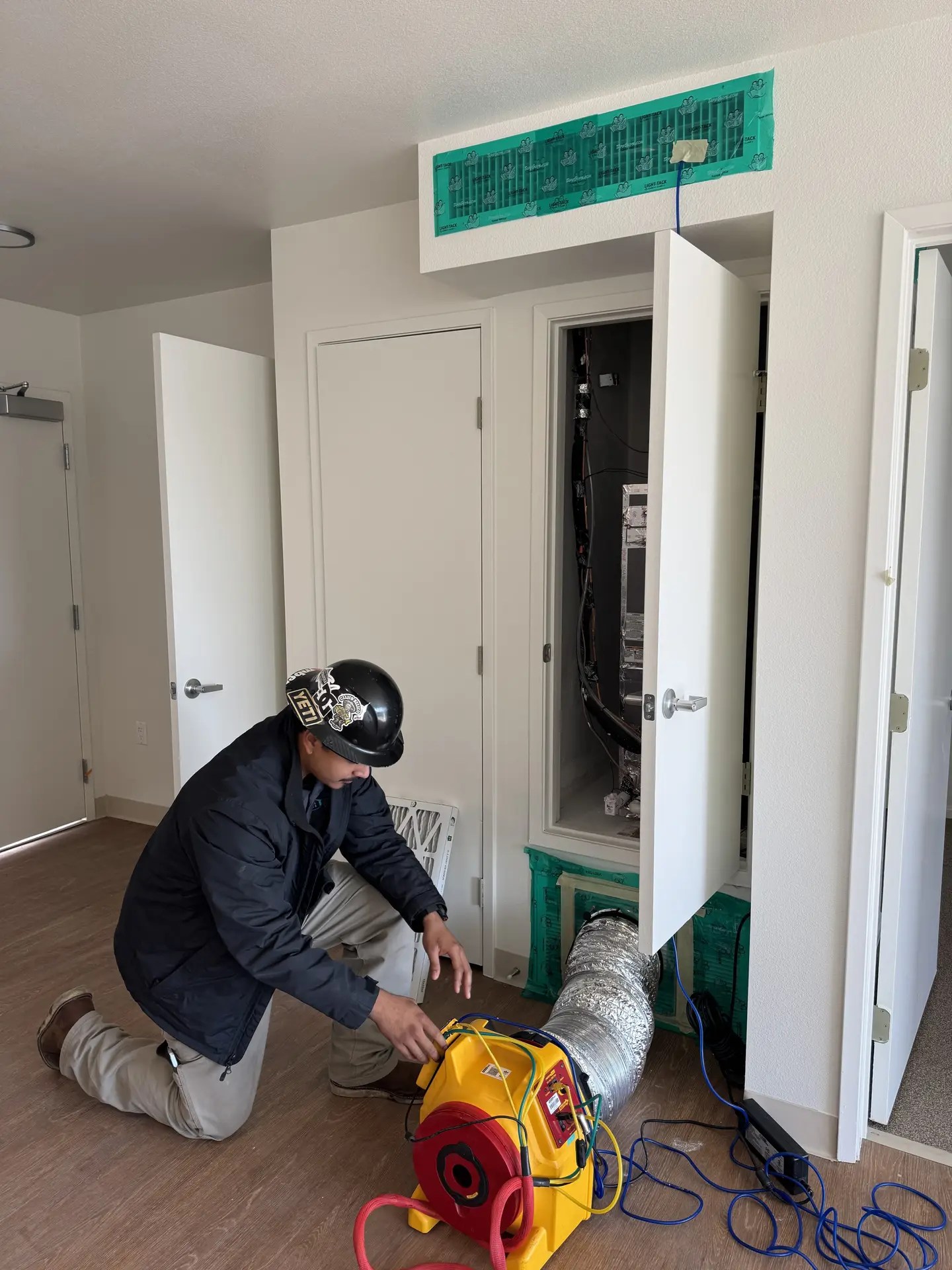 One of our technicians conducting the duct leakage test, a key field diagnostic test of the ECC/HERS verification and testing.
