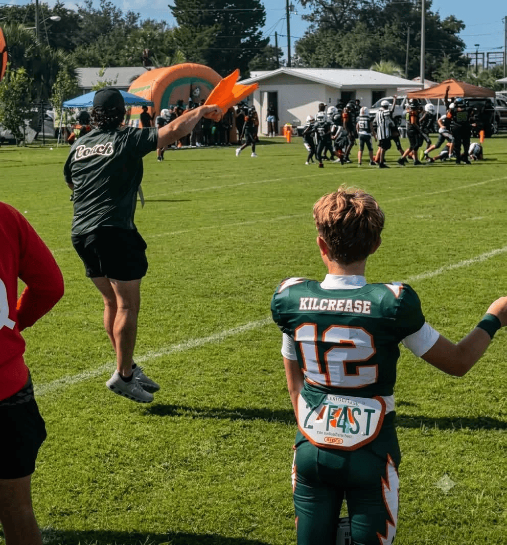 Coach Sheffer Kilcrease on the football sideline with his son Bryson